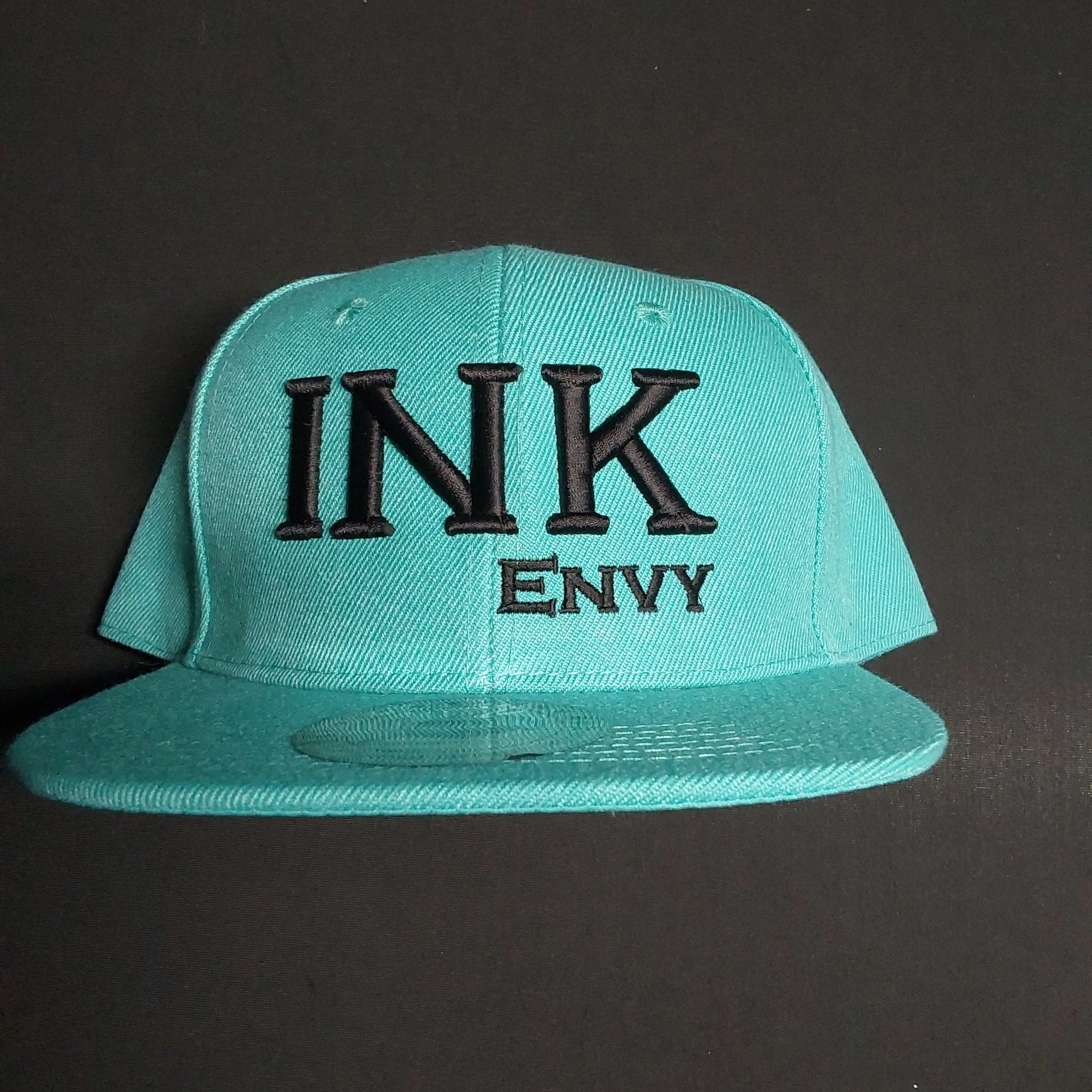 Snapback Bold INK  Black on teal With Puff Lettering
